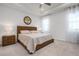 Warm and inviting primary bedroom with soft carpet, natural light, and a modern decor at 3677 Turning Tides Ter, Bradenton, FL 34208