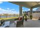 Relaxing screened lanai with comfortable seating and a beautiful water view at 3677 Turning Tides Ter, Bradenton, FL 34208