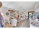 Comfortable living room with beach decor, bright floral rug, and access to a screened patio at 3807 41St Street W Ct # 52, Bradenton, FL 34205