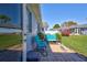 Outdoor patio with blue seating, and access to a green yard in a tranquil neighborhood at 3807 41St Street W Ct # 52, Bradenton, FL 34205