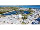 Stunning aerial view showcasing the community, with water views and lush greenery surrounding at 4 Braden Castle Dr, Bradenton, FL 34208