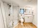 Bathroom features a marble-tiled shower, and updated vanity at 4 Braden Castle Dr, Bradenton, FL 34208