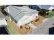 Aerial shot of a charming home with meticulous landscaping, including gravel and potted plants at 4 Braden Castle Dr, Bradenton, FL 34208