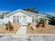 Charming single-story home featuring well-manicured landscaping and a welcoming front entrance at 4 Braden Castle Dr, Bradenton, FL 34208