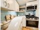 Bright kitchen features stainless steel appliances, white cabinets, and light blue backsplash at 4 Braden Castle Dr, Bradenton, FL 34208