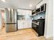 Modern kitchen with stainless steel appliances, white cabinets, and a sleek gas range at 4 Braden Castle Dr, Bradenton, FL 34208
