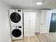 Laundry room features a stacked washer and dryer set and an additional wardrobe at 4 Braden Castle Dr, Bradenton, FL 34208