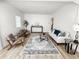 Bright living room featuring hardwood floors, neutral decor, and stylish furnishings at 4 Braden Castle Dr, Bradenton, FL 34208