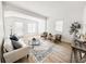 Bright living room featuring hardwood floors, neutral decor, and stylish furnishings at 4 Braden Castle Dr, Bradenton, FL 34208