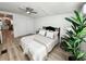 Serene bedroom with a ceiling fan, hardwood floors, and a plush bed at 4 Braden Castle Dr, Bradenton, FL 34208