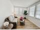Sunroom includes a wicker sofa, side tables, and large windows at 4 Braden Castle Dr, Bradenton, FL 34208