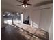 Bright living room with wood-look flooring and sliding door access offers a seamless transition to outdoor living at 4031 Iola Dr, Sarasota, FL 34231