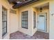 Inviting front entrance with brick pavers, white door, and accent windows for natural light at 4122 Bella Pasque, Venice, FL 34293