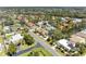 Residential aerial view featuring mature trees and community pond at 417 Tortuga Dr, Nokomis, FL 34275