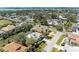 Beautiful aerial view showcasing a well-maintained home with lush landscaping and a tranquil pond at 417 Tortuga Dr, Nokomis, FL 34275