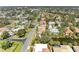 Residential aerial view featuring mature trees and community pond at 417 Tortuga Dr, Nokomis, FL 34275