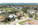 Picturesque aerial view of a well-situated home, highlighting its manicured lawn and mature trees at 417 Tortuga Dr, Nokomis, FL 34275