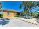 Backyard patio area with fire pit and water view at 417 Tortuga Dr, Nokomis, FL 34275