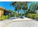 Patio area with fire pit and a scenic view of the canal at 417 Tortuga Dr, Nokomis, FL 34275