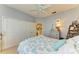 Coastal bedroom with ceiling fan, built-in closet, dresser, and decor at 417 Tortuga Dr, Nokomis, FL 34275