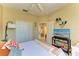 Bedroom with ceiling fan, large closet, TV and entertainment center and queen size bed at 417 Tortuga Dr, Nokomis, FL 34275