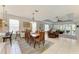 This dining area showcases views of a large living space, and an outdoor lanai at 417 Tortuga Dr, Nokomis, FL 34275