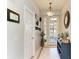 Inviting entryway with decorative mirror and tile flooring at 417 Tortuga Dr, Nokomis, FL 34275