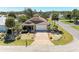 Beautiful home featuring a brick driveway, two-car garage, and lush landscaping at 417 Tortuga Dr, Nokomis, FL 34275