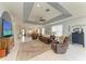 Open-concept living room featuring tile flooring and a ceiling fan at 417 Tortuga Dr, Nokomis, FL 34275