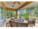 Comfortable screened-in patio with scenic water views, perfect for outdoor relaxation at 417 Tortuga Dr, Nokomis, FL 34275