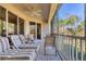 Spacious screened balcony with comfortable seating, overlooking the lush landscaping at 4480 Cinnamon Dr # 2408, Sarasota, FL 34238