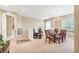 Bright dining area features a chandelier, a large window, and a dining table set for six at 4480 Cinnamon Dr # 2408, Sarasota, FL 34238