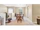 Open-concept dining room showcasing a chandelier, large window, and a dining table with six chairs at 4480 Cinnamon Dr # 2408, Sarasota, FL 34238