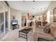 Comfortable living room with tile flooring in the kitchen area and sliding doors to outdoor space at 4480 Cinnamon Dr # 2408, Sarasota, FL 34238