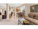 Open-concept living space with dining nook, kitchen, and comfortable seating area at 4480 Cinnamon Dr # 2408, Sarasota, FL 34238