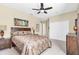 Comfortable main bedroom with ceiling fan and closet at 4480 Cinnamon Dr # 2408, Sarasota, FL 34238