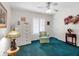 A bright bedroom featuring a large dresser, Tiffany lamp, and chair with view of shuttered window at 4627 Breezy Pines Blvd, Sarasota, FL 34232