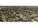An aerial view of a residential area with mature trees, green lawns and proximity to a bay at 4711 Placid Cir, Sarasota, FL 34231