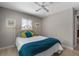 Bright bedroom features a white iron bed, classic decor, and plenty of natural light at 4711 Placid Cir, Sarasota, FL 34231