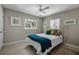 Cozy bedroom features a comfortable bed with stylish decor and bright natural light from two windows at 4711 Placid Cir, Sarasota, FL 34231