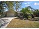 Charming single-story home with a well-manicured front yard and attached two-car garage at 4711 Placid Cir, Sarasota, FL 34231