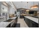 Spacious kitchen with eat in bar and a seamless flow to a bar and billiards area at 4711 Placid Cir, Sarasota, FL 34231
