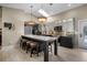 Modern kitchen with light gray cabinets, a large island with seating, and stainless steel appliances at 4711 Placid Cir, Sarasota, FL 34231