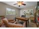 Inviting office space with a classic wooden desk, comfortable seating, and natural light at 4711 Placid Cir, Sarasota, FL 34231