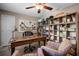 Office boasts a spacious desk, built-in shelving, and plenty of room for productivity and creativity at 4711 Placid Cir, Sarasota, FL 34231