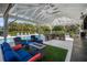 Outdoor kitchen and seating area with a pool view, ideal for entertaining Gathering and friends at 4711 Placid Cir, Sarasota, FL 34231