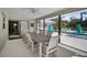 Spacious screened patio with ample seating and views of the backyard pool area at 4711 Placid Cir, Sarasota, FL 34231
