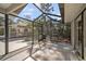 Large screened patio with outdoor dining area, offering a perfect blend of indoor-outdoor living at 4711 Placid Cir, Sarasota, FL 34231