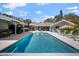 Large pool, patio, and outdoor kitchen, perfect for entertaining, with ample seating at 4711 Placid Cir, Sarasota, FL 34231
