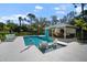 Stunning pool with sun loungers and covered outdoor kitchen, ideal for entertaining guests at 4711 Placid Cir, Sarasota, FL 34231